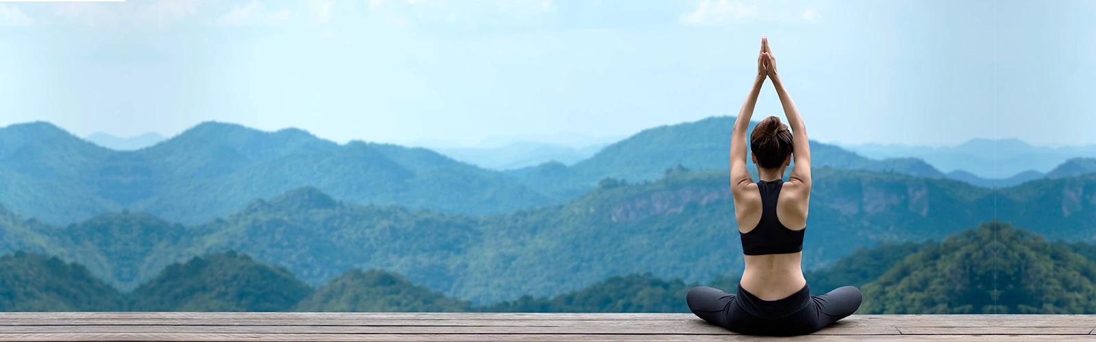 Women meditate on wooden floor Women meditate on wooden floor